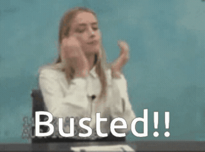 A Woman Is Sitting At A Desk With Her Hands On Her Face And The Words Busted Written In Front Of Her . GIF