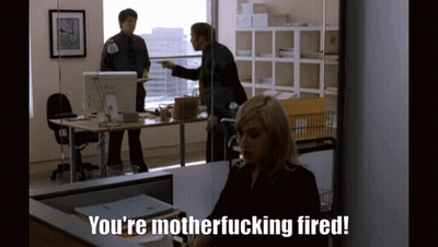 A Woman Is Sitting At A Desk With The Words You 'Re Motherfucking Fired GIF