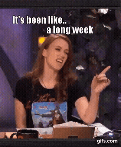 A Woman Is Sitting At A Table And Pointing At Something With The Words " It 'S Been Like A Long Week " GIF