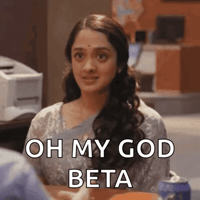 A Woman Is Sitting At A Table And Says Oh My God Beta GIF