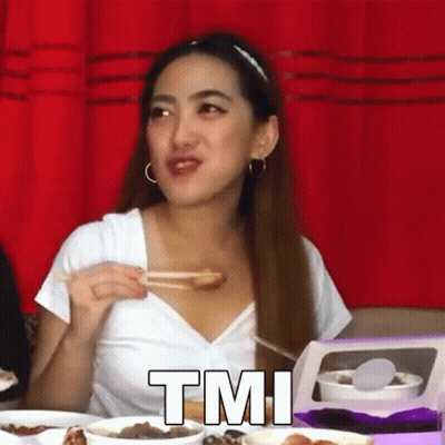 A Woman Is Sitting At A Table Eating Food With Chopsticks And The Word Tmi Is On The Bottom Of The Picture . GIF