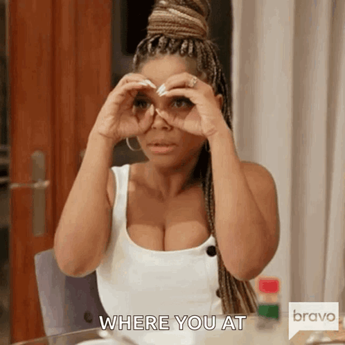 A Woman Is Sitting At A Table Looking Through Binoculars And Says Where You At . GIF