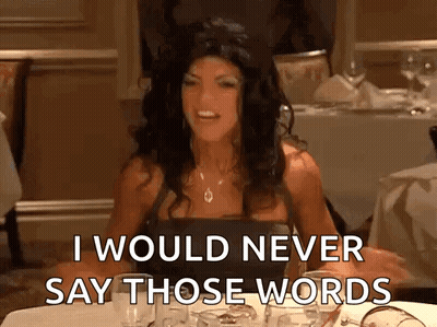 A Woman Is Sitting At A Table Saying I Would Never Say Those Words GIF