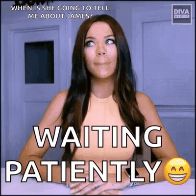 A Woman Is Sitting At A Table Waiting Patiently For Someone To Tell Her About James . GIF