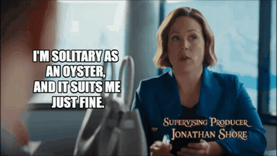 A Woman Is Sitting At A Table With A Caption That Says " I 'M Solitary As An Oyster " GIF