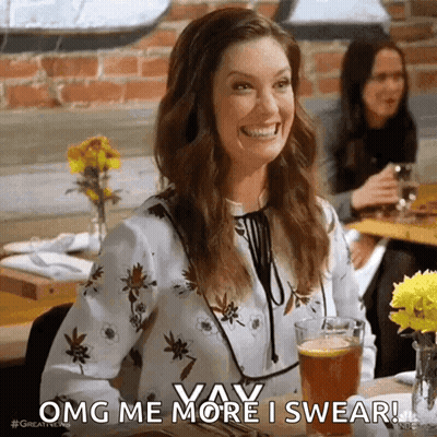 A Woman Is Sitting At A Table With A Glass Of Beer And Smiling While Saying Omg Me More I Swear . GIF