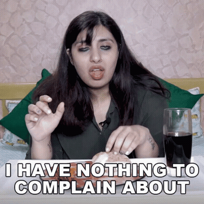 A Woman Is Sitting At A Table With A Glass Of Coke And A Sandwich And Says I Have Nothing To Complain About GIF