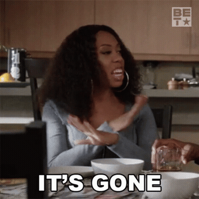 A Woman Is Sitting At A Table With A Glass Of Whiskey And A Bowl Of Food And Says It 'S Gone GIF