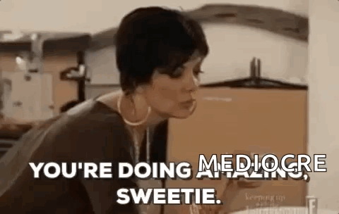 A Woman Is Sitting At A Table With A Glass Of Wine In Her Hand . GIF