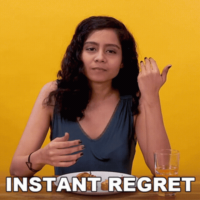 A Woman Is Sitting At A Table With A Plate Of Food And A Glass Of Water With The Words Instant Regret Written On The Bot GIF