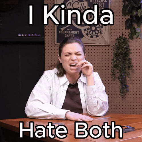 A Woman Is Sitting At A Table With A Sign Behind Her That Says ' I Kinda Hate Both ' GIF