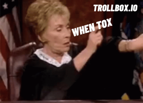 Woman Sitting With When Tox Sign GIF