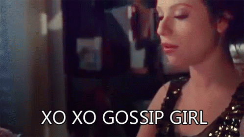 A Woman Is Sitting At A Table With Her Eyes Closed And The Words `` Xo Xo Gossip Girl '' Written On Her Face . GIF