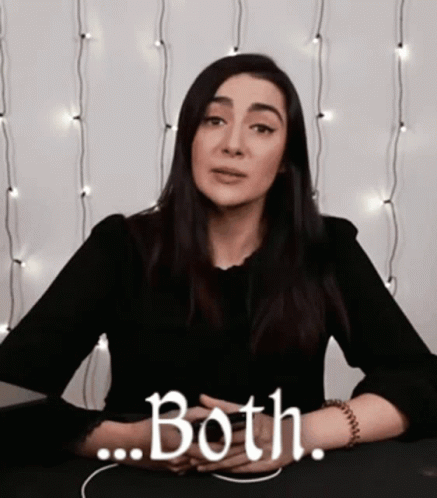 A Woman Is Sitting At A Table With Her Hands Folded And Says Both GIF