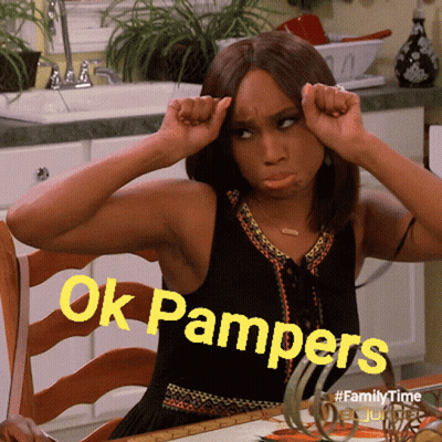 A Woman Is Sitting At A Table With Her Hands On Her Head And The Words Ok Pampers Written In Yellow GIF