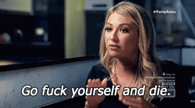 A Woman Is Sitting At A Table With Her Hands Up And Says Go Fuck Yourself And Die . GIF