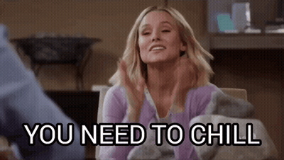A Woman Is Sitting At A Table With Her Hands Up And The Words `` You Need To Chill '' . GIF