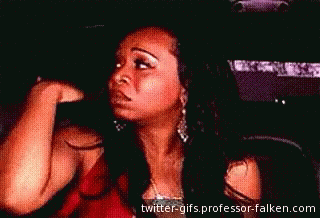 A Woman Is Sitting In A Car With Her Eyes Closed GIF