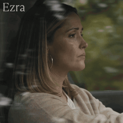 A Woman Is Sitting In A Car With The Words " A Mother 'S Job Is Never Done " GIF