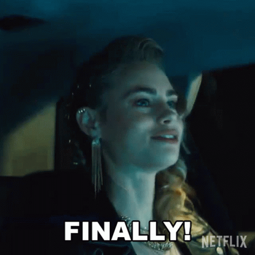 A Woman Is Sitting In A Car With The Words `` Finally '' Written On Her Face . GIF
