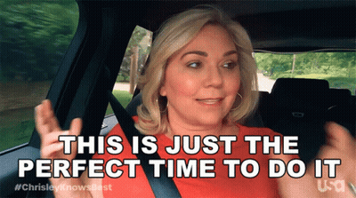 A Woman Is Sitting In A Car With The Words " This Is Just The Perfect Time To Do It " GIF