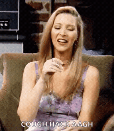 A Woman Is Sitting In A Chair And Laughing . GIF