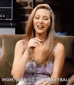 A Woman Is Sitting In A Chair And Laughing While Saying `` Mom , I Can Go To Basketball '' . GIF