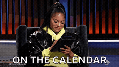 A Woman Is Sitting In A Chair Looking At A Tablet And The Words On The Calendar Are Visible . GIF