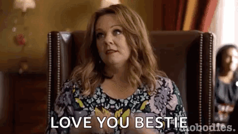 A Woman Is Sitting In A Chair Saying `` I Love You Bestie '' . GIF