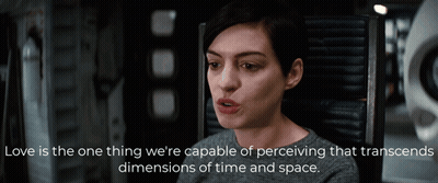A Woman Is Sitting In A Chair With A Quote That Says Love Is The One Thing We 'Re Capable Of Perceiving GIF