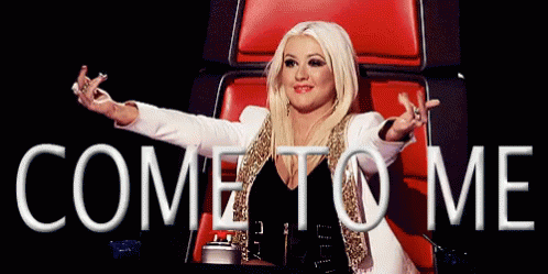 A Woman Is Sitting In A Chair With Her Arms Outstretched And The Words Come To Me Above Her GIF