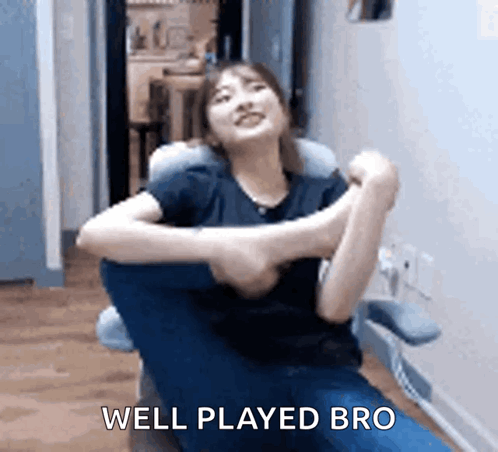 A Woman Is Sitting In A Chair With Her Arms Outstretched And The Words `` Well Played Bro '' Written Above Her . GIF
