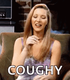 A Woman Is Sitting In A Chair With Her Eyes Closed And The Word Coughy Written On Her Face . GIF