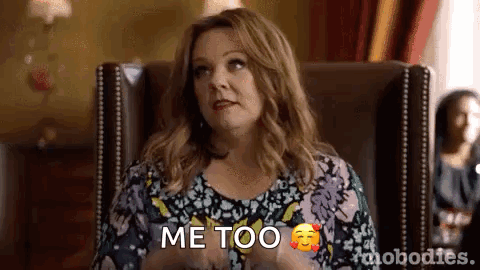 A Woman Is Sitting In A Chair With Her Hands On Her Hips And Says `` Me Too '' . GIF