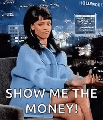 A Woman Is Sitting In A Chair With Her Legs Crossed And Saying `` Show Me The Money '' . GIF