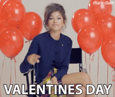 A Woman Is Sitting In A Chair With Red Balloons And The Words Valentine 'S Day Written Below Her GIF