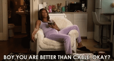 A Woman Is Sitting In A Chair With The Words Boy You Are Better Than Cable Okay On The Bottom GIF