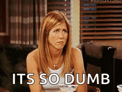 A Woman Is Sitting In A Chair With The Words It 'S So Dumb On The Bottom GIF