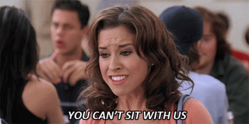 A Woman Is Sitting In A Crowd Of People And Says `` You Can 'T Sit With Us '' GIF