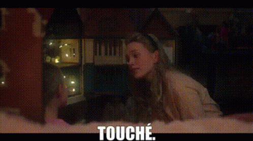 A Woman Is Sitting In A Dark Room Looking Out A Window And The Words `` Touche '' Are Above Her . GIF