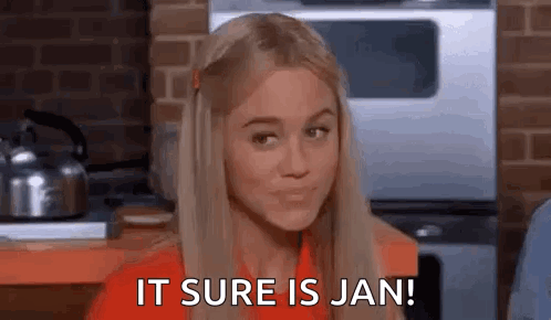 A Woman Is Sitting In A Kitchen And Says `` It Sure Is Jan ! '' GIF