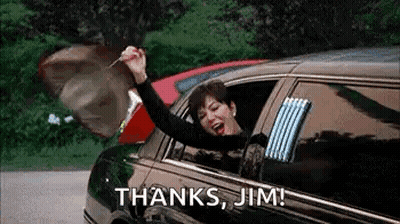 A Woman Is Sitting In A Limousine With Her Arms In The Air And Holding A Key In Her Hand . GIF