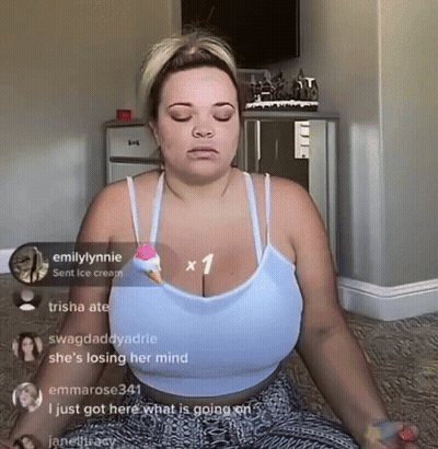 A Woman Is Sitting In A Lotus Position With Her Eyes Closed GIF