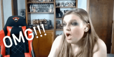 A Woman Is Sitting In A Red And Black Chair With The Word Omg Written On It GIF