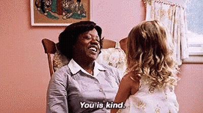 A Woman Is Sitting In A Rocking Chair Talking To A Little Girl And Saying `` You Is Kind '' . GIF
