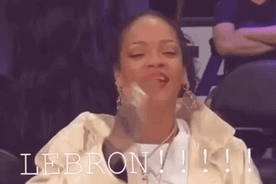 A Woman Is Sitting In A Stadium With The Word Lebron Written On The Bottom GIF