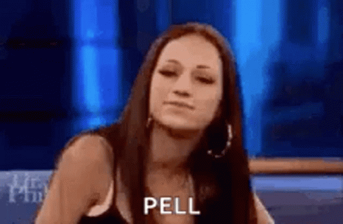 A Woman Is Sitting In Front Of A Blue Background And Making A Funny Face While Talking On A Television Show . GIF