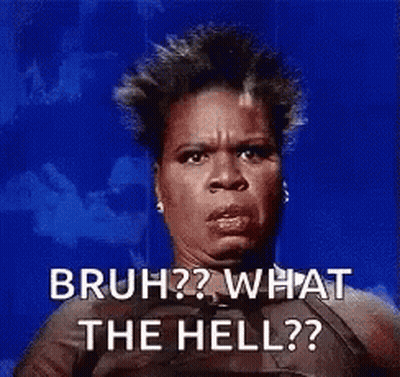 A Woman Is Sitting In Front Of A Blue Background And Making A Funny Face . GIF