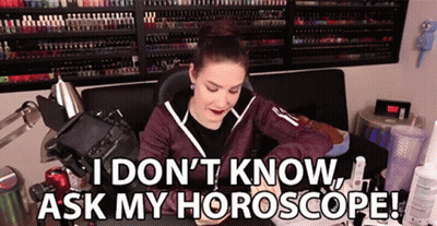 A Woman Is Sitting In Front Of A Camera With The Words I Don 'T Know Ask My Horoscope . GIF