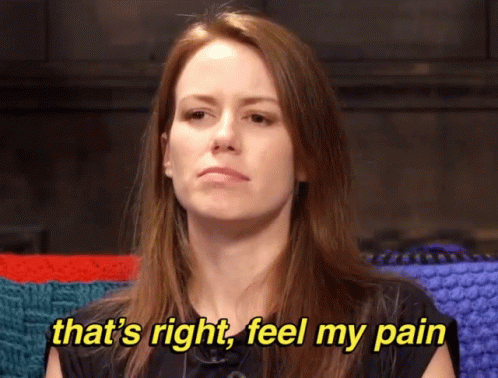 A Woman Is Sitting In Front Of A Knitted Blanket And Says That 'S Right Feel My Pain GIF